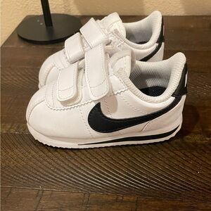 Nike Kids White Sneakers with Black Swoosh and Velcro Straps